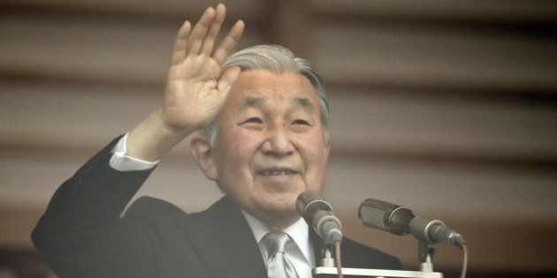 Japanese Emperor Akihito waves to well-wishers from the balcony of the Imperial Palace in Tokyo on December 23, 2015. Thousands of people gathered at the palace to celebrate Emperor Akihito's 82nd birthday. AFP PHOTO / TOSHIFUMI KITAMURA / AFP / TOSHIFUMI KITAMURA (Photo credit should read TOSHIFUMI KITAMURA/AFP/Getty Images)