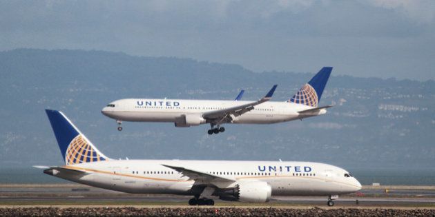 A United Airlines Boeing 787 taxis as a United Airlines Boeing 767 lands at San Francisco International Airport, San Francisco, California, February 7, 2015. REUTERS/Louis Nastro/File Photo