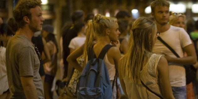 BARCELONA, SPAIN - AUGUST 17: People gather at the scene after a van plowed into the crowd, injuring several people in Barcelona, Spain on August 17, 2017. (Photo by Albert Llop/Anadolu Agency/Getty Images)