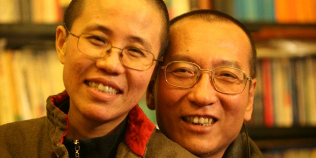 Chinese dissident Liu Xiaobo and his wife Liu Xia pose in this undated photo released by his family on October 3, 2010. Imprisoned Chinese pro-democracy activist Liu Xiaobo won the Nobel Peace Prize on October 8, 2010, an announcement that Beijing had anticipated and bitterly criticised. REUTERS/Handout (CHINA - Tags: POLITICS) FOR EDITORIAL USE ONLY. NOT FOR SALE FOR MARKETING OR ADVERTISING CAMPAIGNS. THIS IMAGE HAS BEEN SUPPLIED BY A THIRD PARTY. IT IS DISTRIBUTED, EXACTLY AS RECEIVED BY REUTERS, AS A SERVICE TO CLIENTS