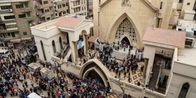 TANTA, EGYPT - APRIL 9: People gather in front of the Saint George church after a bombing struck inside the church in the Nile Delta city of Tanta, Egypt on April 9, 2017. At least 21 people were killed. (Photo by Ibrahim Ramadan/Anadolu Agency/Getty Images)
