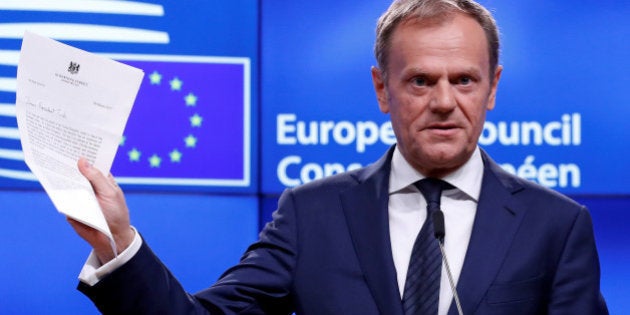 European Council President Donald Tusk shows British Prime Minister Theresa May's Brexit letter in notice of the UK's intention to leave the bloc under Article 50 of the EU's Lisbon Treaty, at the end of a news conference in Brussels, Belgium March 29, 2017. REUTERS/Yves Herman TPX IMAGES OF THE DAY