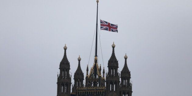 A union flag flies over Parliament at half-mast the morning after an attack by a man driving a car and weilding a knife left five people dead and dozens injured, in London, Britain, March 23, 2017. REUTERS/Neil Hall