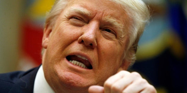 U.S. President Donald Trump looks up during a meeting about healthcare at the White House in Washington, U.S., March 13, 2017. REUTERS/Kevin Lamarque