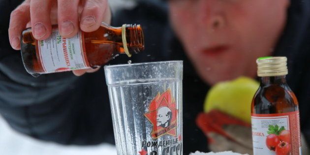 IVANOVO, RUSSIA - DECEMBER 19, 2016: A man pours Hawthorn infusion into a glass. The Russian Government demanded to withdraw the Hawthorn infusion and other alcohol containing products from retail after a deadly poisoning in Irkutsk. Vladimir Smirnov/TASS (Photo by Vladimir Smirnov\TASS via Getty Images)
