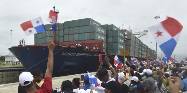 TOPSHOT - Chinese-chartered merchant ship Cosco Shipping Panama crosses the new Agua Clara Locks during the inauguration of the expansion of the Panama Canal in Colon, 80 km from Panama City on June 26, 2016 on June 26, 2016.A giant Chinese-chartered freighter nudged its way into the expanded Panama Canal on Sunday to mark the completion of nearly a decade of work forecast to boost global trade. / AFP / RODRIGO ARANGUA (Photo credit should read RODRIGO ARANGUA/AFP/Getty Images)
