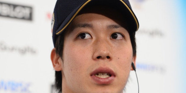 TOKYO, JAPAN - NOVEMBER 21: Tetsuto Yamada #23 of Japan speaks to the press after winning the WBSC Premier 12 third place play off match between Japan and Mexico at the Tokyo Dome on November 21, 2015 in Tokyo, Japan. (Photo by Masterpress/Getty Images)