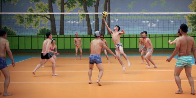 North Koreans dressed in their swim suits play a round of volleyball at the Munsu water park on Tuesday, Dec. 1, 2015, in Pyongyang, North Korea. The water park is opened to both tourists as well as locals living in the North Korean capital. (AP Photo/Wong Maye-E)