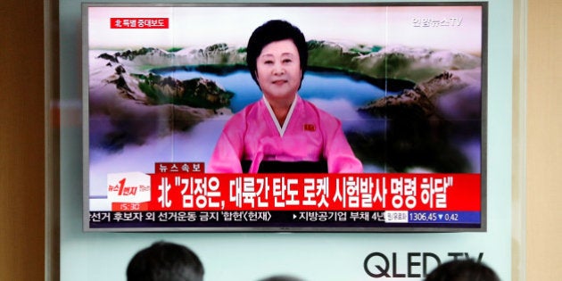 People watch a TV broadcast of a news report on North Korea's Hwasong-14 missile, a new intercontinental ballistic missile, which they said is successfully tested, at a railway station in Seoul, South Korea, July 4, 2017. REUTERS/Kim Hong-Ji