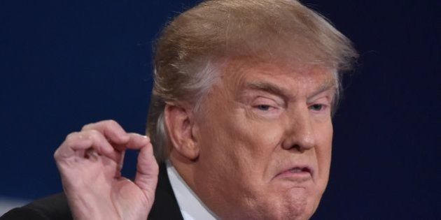 Republican nominee Donald Trump gestures during the first presidential debate at Hofstra University in Hempstead, New York on September 26, 2016. / AFP / Paul J. Richards (Photo credit should read PAUL J. RICHARDS/AFP/Getty Images)