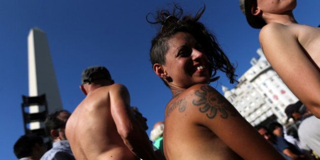 Topless women attend a protest in response to a recent incident on an Argentine resort beach between police and topless sunbathers, in downtown Buenos Aires, Argentina, February 7, 2017. REUTERS/Marcos Brindicci