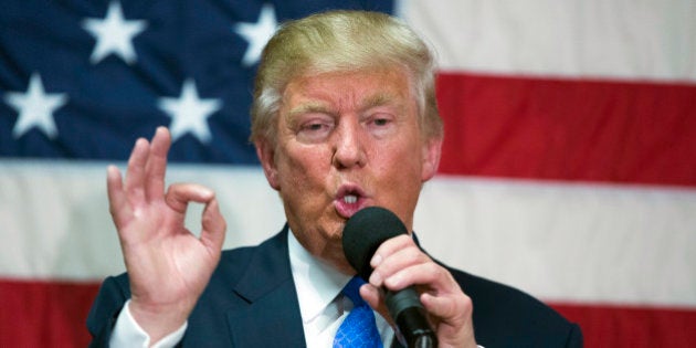 In this Oct. 6, 2016, photo, Republican presidential candidate Donald Trump speaks during a town hall in Sandown, N.H. Trump made a series of lewd and sexually charged comments about women as he waited to make a cameo appearance on a soap opera in 2005. The Republican presidential nominee issued a rare apology Friday, âif anyone was offended.â (AP Photo/ Evan Vucci)