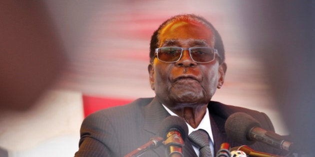 President Robert Mugabe waits to address mourners gathered for the funeral of former cabinet minister and ZANU-PF member Cephas Msipa in Harare, Zimbabwe, October 22, 2016. REUTERS/Philimon Bulawayo TPX IMAGES OF THE DAY