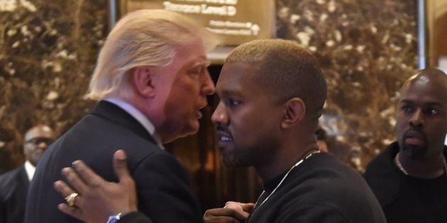 Singer Kanye West and President-elect Donald Trump talk at Trump Tower after meetings on December 13, 2016 in New York. / AFP / TIMOTHY A. CLARY (Photo credit should read TIMOTHY A. CLARY/AFP/Getty Images)