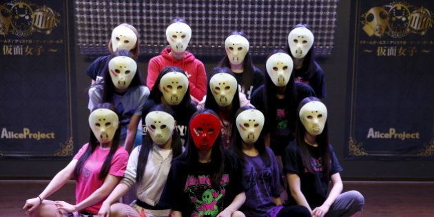 Members of Japanese idol group Kamen Joshi (Masked Girls) pose for a photo after a rehearsal for a concert at their theatre in Tokyo's Akihabara district, Japan March 17, 2016. For countless girl and pop-idol bands in Japan, standing out from the crowd can be daunting, but one group -