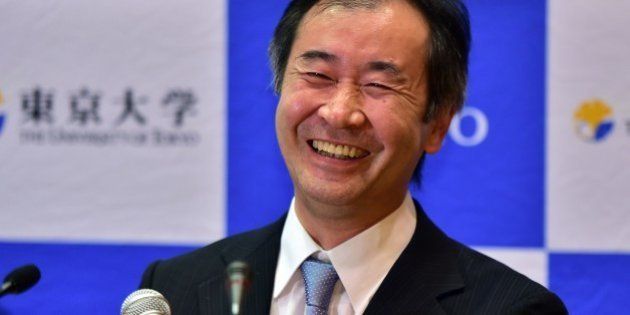 Takaaki Kajita, a professor at the University of Tokyo Institute for Cosmic Ray Research smiles at a press conference after it was announced he had won the Nobel Physics Prize at the University of Tokyo on October 6, 2015, for resolving a mystery with co-winner Arthur McDonald of Canada about neutrinos, a fundamental but enigmatic particle. The pair were honoured for work that helped determine that neutrinos have mass, the Royal Swedish Academy of Sciences said. AFP PHOTO / Yoshikazu TSUNO (Photo credit should read YOSHIKAZU TSUNO/AFP/Getty Images)