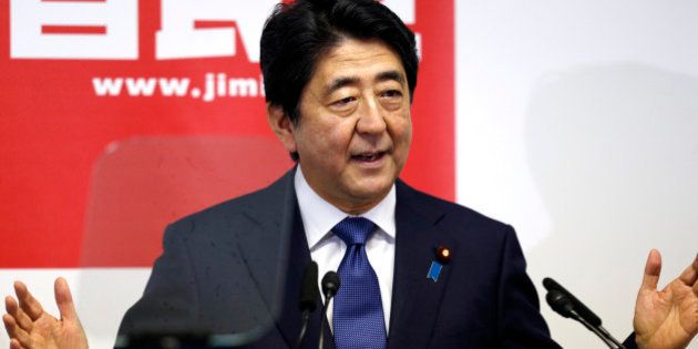 Japanese Prime Minister Shinzo Abe delivers a speech during a press conference at the headquarters of his ruling Liberal Democratic Party in Tokyo, Thursday, Sept. 24, 2015. Prime Minister Abe, fresh from a bruising battle over unpopular military legislation, announced Thursday an updated plan for reviving the world's third-largest economy, setting a GDP target of 600 trillion yen ($5 trillion).(AP Photo/Shuji Kajiyama)