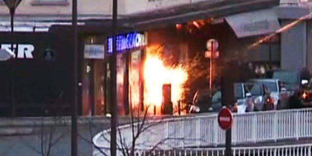 A screengrab taken from an AFP TV video shows a general view of members of the French police special forces launching the assault at a kosher grocery store in Porte de Vincennes, eastern Paris, on January 9, 2015 where at least two people were shot dead on January 9 during a hostage-taking drama at a Jewish supermarket in eastern Paris, and five people were being held, official sources told AFP. Several hostages were freed after French commandos stormed a Jewish supermarket in eastern Paris where an assailant was holed up on January 9. After several explosions, police stormed the shop in Portes de Vincennes and everal hostages exited the store shortly afterwards and were taken to safety. AFP PHOTO / AFPTV / GABRIELLE CHATELAIN (Photo credit should read GABRIELLE CHATELAIN/AFP/Getty Images)