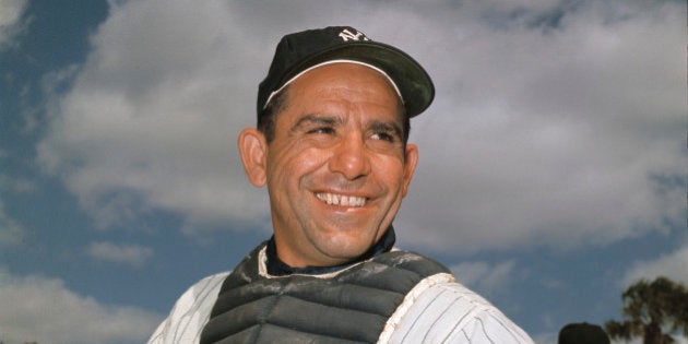 File-New York Yankee catcher Yogi Berra poses at spring training in Florida, in an undated file photo....