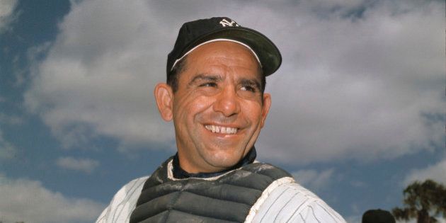 File-New York Yankee catcher Yogi Berra poses at spring training in Florida, in an undated file photo. Berra, the Yankees Hall of Fame catcher has died. He was 90. (AP Photo/File)