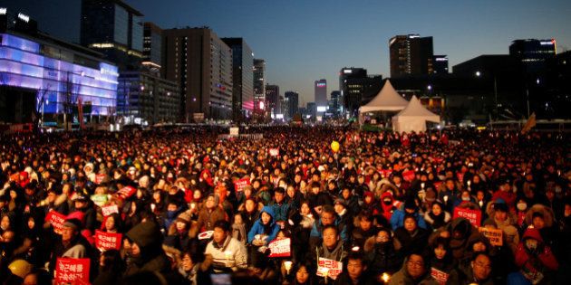 People attend a protest calling for South Korean President Park Geun-hye to step down in central Seoul, South Korea, December 10, 2016. REUTERS/Kim Hong-Ji