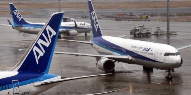 All Nippon Airways (ANA) passenger jets are seen on the runway at Haneda airport in Tokyo on January 29, 2016. ANA on January 29 announced its 9-month profit surged 40 percent as international business expanded. AFP PHOTO / Toru YAMANAKA / AFP / TORU YAMANAKA (Photo credit should read TORU YAMANAKA/AFP/Getty Images)