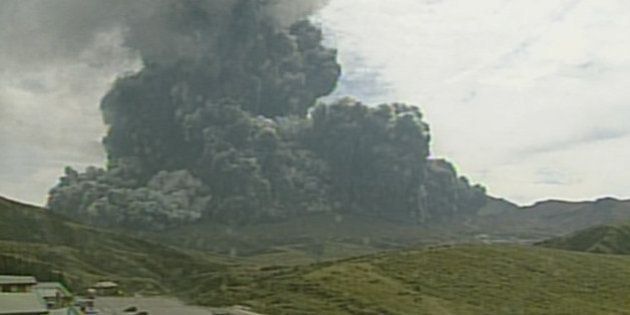 In this image taken from a surveillance camera observed from Kusasenri and released by Japan Meteorological Agency, a column of black smoke rises from Mount Aso, Kumamoto prefecture, southern Japan Monday, Sept. 14, 2015. Mount Aso, a volcano on the southern Japanese island of Kyushu, has erupted, sending huge plumes of black and then white smoke 2,000 meters (6,560 feet) into the air. (Japan Meteorological Agency via AP) CREDIT MANDATORY