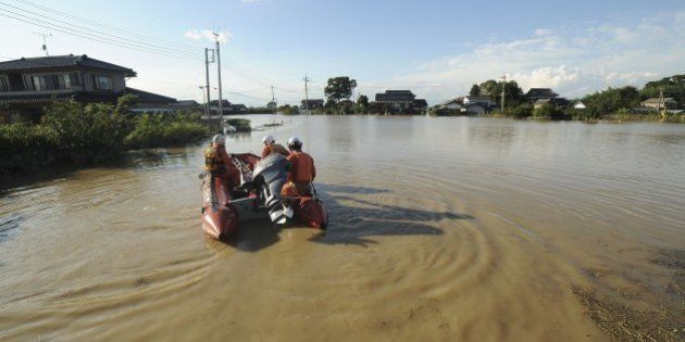 JOSO, JAPAN - SEPTEMBER 11 : Firefighters and Japan Self-Defense Force conduct search and rescue operations in Joso city, Ibatraki region after flooding in the northern of Japan on September 11, 2015. Flooding in the northern of Japan forced the evacuation of thousands of people and left large parts of one town submerged in Japan on September 11, 2015. Many parts of central and eastern Japan have been hit in recent days by torrential rain and heavy winds caused by Typhoon Etau. (Photo by David Mareuil/Anadolu Agency/Getty Images)