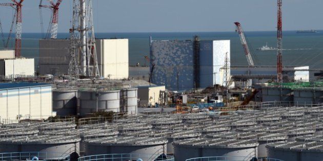 A coast guard vessel (back R) patrols the waters off the Fukushima Daiichi nuclear power plant in Okuma, Fukushima prefecture on October 9, 2015. Tokyo Electric Power Co (TEPCO), which operates the plant in eastern Japan, held a foreign press tour to the crippled Fukushima nuclear power plant on October 9 showing flange tanks dismantling the site, subdrain pit, relaying tanks, land-side and sea-side impermeable walls. AFP PHOTO / TOSHIFUMI KITAMURA (Photo credit should read TOSHIFUMI KITAMURA/AFP/Getty Images)