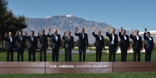 TOPSHOT - US President Barack Obama and leaders take part in a group photo during a meeting of the Association of Southeast Asian Nations (ASEAN) at the Sunnylands estate on February 16, 2016 in Rancho Mirage, California. From left: ASEAN Secretary General Le Luong Minh, Brunei's Sultan Hassanal Bolkiah, Cambodia's Prime Minister Hun Sen, Indonesia's President Joko Widodo, Malaysia's Prime Minister Najib Razak, Laos' President Choummaly Sayasone, Obama, Philippine's President Benigno Aquino, Singapore's Prime Minister Lee Hsien Loong, Thailand's Prime Minister Prayut Chan-O-Cha, Vietnam's Prime Minister Nguyen Tan Dung, and Myanmar's Vice President Nyan Tun. / AFP / MANDEL NGAN (Photo credit should read MANDEL NGAN/AFP/Getty Images)