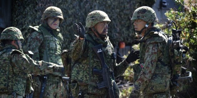 Japanese soldiers prepare during an amphibious landing operation with US Forces and the Japan Maritime Self-Defense Force (JMSDF) at the Dawn Blitz 2015 exercise in Camp Pendleton, California on September 5, 2015. Japan's defense ministry has made its biggest ever budget request, as Tokyo bolsters its military amid lingering territorial rows and worries over China's expanding naval reach. The ministry wants 5.09 trillion yen ($42 billion) for the next fiscal year, with the focus on strengthening protection of a string of southern islands that stretch from Japan's mainland to waters near Taiwan. AFP PHOTO / MARK RALSTON (Photo credit should read MARK RALSTON/AFP/Getty Images)