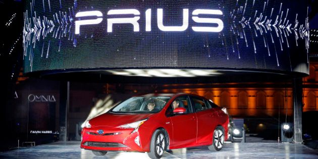 Toyota unveils the latest version of the Prius at an event Tuesday, Sept. 8, 2015, in Las Vegas. The car is still the No. 1 hybrid on the market but has been a tougher sell for dealers with gas prices below $3 in many areas of the country. (AP Photo/John Locher)
