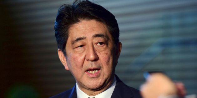 Japanese Prime Minister SHinzo Abe speaks to reporters at his official residence in Tokyo Tuesday, Sept. 8, 2015. Abe has won a new term as president of the ruling Liberal Democratic Party after facing no opposition for the job. (Yoshikazu Tsuno/Pool Photo via AP)