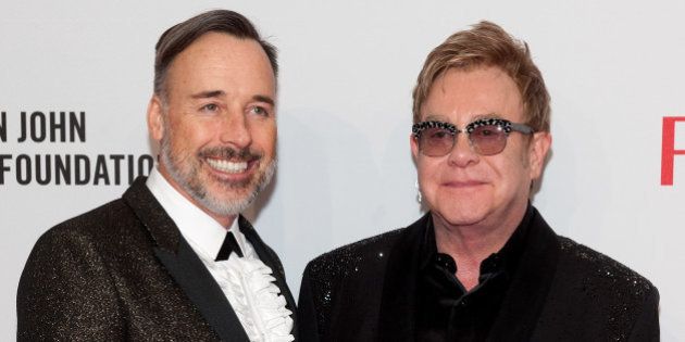 NEW YORK, NY - OCTOBER 28: Elton John (R) and David Furnish attend the Elton John AIDS Foundation's 13th Annual An Enduring Vision Benefit at Cipriani Wall Street on October 28, 2014 in New York City. (Photo by D Dipasupil/FilmMagic)