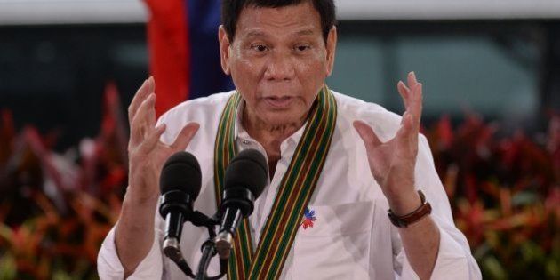 Philippine President Rodrigo Duterte gestures as he delivers a speech during a 'talk to the troops' visit to meet military personnel in Manila on October 4, 2016.Rodrigo Duterte launched a fresh tirade at the United States on October 4, telling Barack Obama to 'go to hell' as the longtime allies launched war games that the firebrand Philippine leader warned could be their last. / AFP / TED ALJIBE (Photo credit should read TED ALJIBE/AFP/Getty Images)