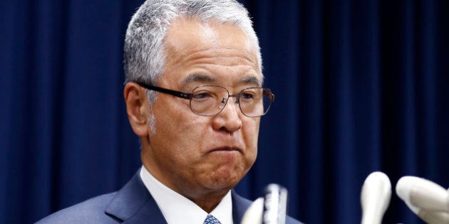Japanese Economy Minister Akira Amari bites his lips during a nationally televised news conference in Tokyo, Thursday, Jan. 28, 2016. Amari said he intends to resign due to allegations he accepted bribes from a construction company. The scandal surfaced after the magazine Weekly Bunshun reported that Amari and his aides accepted at least 12 million yen ($103,000) in cash and hospitality from the unnamed construction company. (AP Photo/Shizuo Kambayashi)