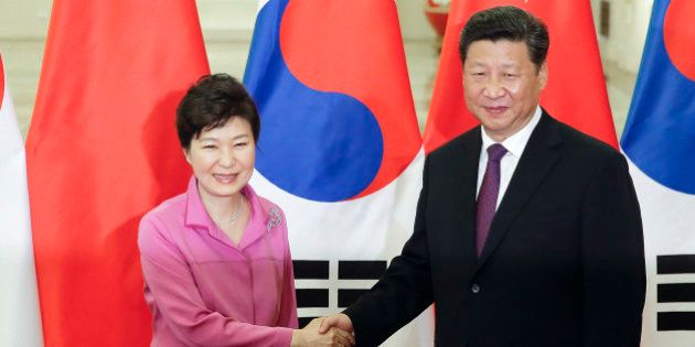 Chinese President Xi Jinping, right, shakes hands with South Korean President Park Geun-hye at the Great Hall of the People in Beijing, Wednesday, Sept. 2, 2015. World leaders are in Beijing to attend events related to China's commemoration of the 70th anniversary of the end of World War II. (Lintao Zhang/Pool Photo via AP)