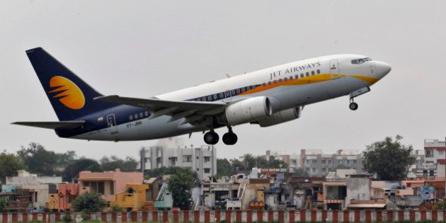 A Jet Airways passenger aircraft takes off from the airport in the western Indian city of Ahmedabad August 12, 2013. Jet recently won a key regulatory approval for its deal to sell a 24 percent stake to Etihad for $379 million, which will be the biggest foreign investment in the Indian civil aviation sector after ownership rules were relaxed. The companies, which need some more approvals, are yet to close the deal. REUTERS/Amit Dave (INDIA - Tags: TRANSPORT BUSINESS)