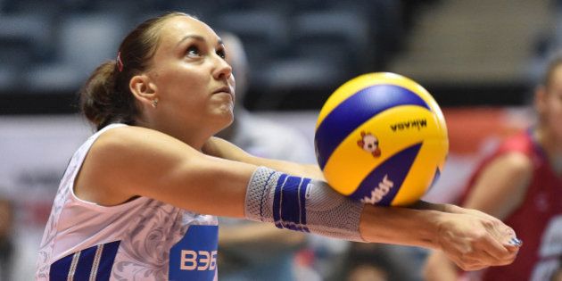 TOKYO, JAPAN - AUGUST 26: Victoria Kuzyakina of Russia receives in the match between Argentina and Russia during the FIVB Women's Volleyball World Cup Japan 2015 at Yoyogi National Stadium on August 26, 2015 in Tokyo, Japan. (Photo by Atsushi Tomura/Getty Images for FIVB)