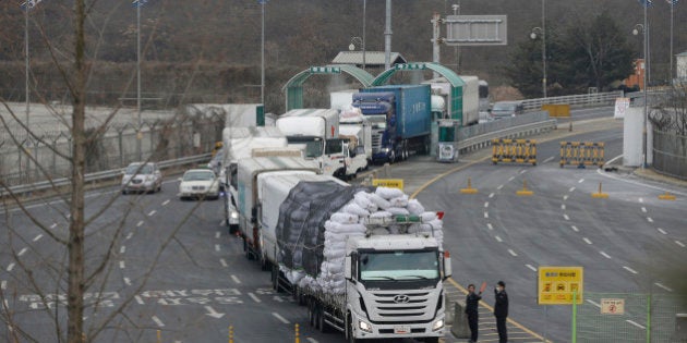 South Korean vehicles returning from North Korea's joint Kaesong Industrial Complex pass the customs, immigration and quarantine office near the border village of Panmunjom in Paju, South Korea, Thursday, Feb. 11, 2016. North Korea on Thursday ordered a military takeover of a factory park that was the last major symbol of cooperation with South Korea, saying Seoul's suspension of operations at the jointly run facility was a