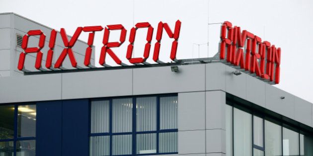 The logo of Aixtron SE is pictured on the roof of the German chip equipment maker's headquarters in Herzogenrath near the western German city of Aachen, October 25, 2016. Fujian Grand Chip Investment Fund LP (FGC), a Chinese company bidding to buy Aixtron in a 670 million euro ($728 million) deal, said on Tuesday it may push ahead with its takeover plans even though the Germany government unexpectedly withdraws approval of the deal. REUTERS/Wolfgang Rattay