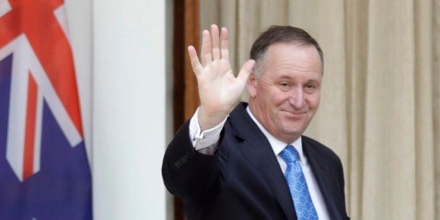 FILE - In this Oct. 26, 2016 file photo, New Zealand's Prime Minister John Key waves to media before his meeting with Indian counterpart Narendra Modi in New Delhi, India. John Key stunned the nation on Monday, Dec. 5 when he announced he was resigning after eight years as leader. (AP Photo/Manish Swarup, File)