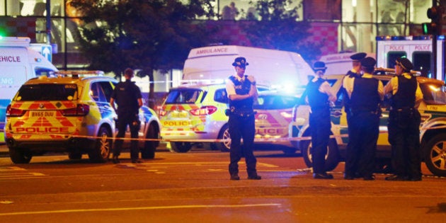 Police officers attend to the scene after a vehicle collided with pedestrians in the Finsbury Park neighborhood of North London, Britain June 19, 2017. REUTERS/Neil Hall