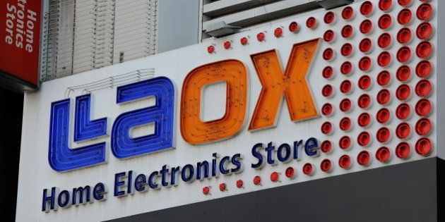 This picture shows the exterior signage of a Laox home electronics shop in Akihabara in Tokyo on May 12, 2010. AFP PHOTO/Toru YAMANAKA (Photo credit should read TORU YAMANAKA/AFP/Getty Images)