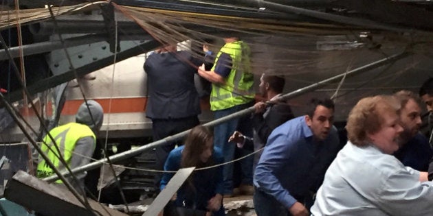 HOBOKEN, NJ - SEPTEMBER 29: Passengers rush to safety after a NJ Transit train crashed in to the platform at the Hoboken Terminal September 29, 2016 in Hoboken, New Jersey. New Jersey emergency's management system is reporting more than 100 people were injured in the crash. (Photo by Pancho Bernasconi/Getty Images)