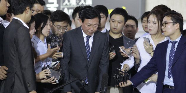 SEOUL, SOUTH KOREA - AUGUST 03: Shin Dong-Bin, the younger son of Lotte Group founder Shin Kyuk-Ho speaks with the media as he arrives from Japan at Gimpo airport on August 3, 2015 in Seoul, South Korea. Shin Dong-joo, the eldest son of Lotte Group founder was fired from Lotte Holdings in Japan in January, and the second son, Shin Dong-bin was appointed chairman of the holding firm early July 2015. Then, Dong-bin has fired his father as general chairman of the Japanese holding comp. (Photo by Chung Sung-Jun/Getty Images)