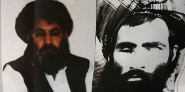 An Afghan newspaper headlines pictures of the new leader of the Afghan Taliban, Mullah Akhtar Mohammad Mansoor, left, and Mullah Mohammad Omar, in Kabul, Afghanistan, Saturday, Aug. 1, 2015. The new leader of the Afghan Taliban vowed to continue his group's bloody, nearly 14-year insurgency in an audio message released Saturday, urging his fighters to remain unified after the death of their longtime leader. (AP Photo/Rahmat Gul)