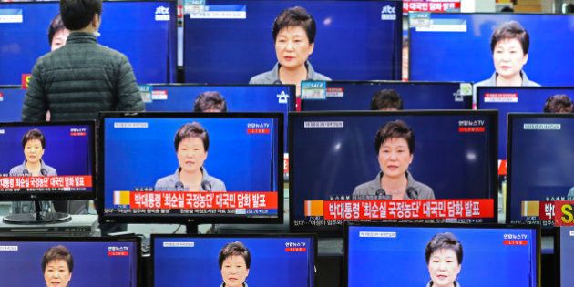 TV screens display the live broadcast of South Korean President Park Geun-hye's public announcement at an electronic shop in Seoul, South Korea, Tuesday, Nov. 29, 2016. The embattled president says sheâll resign if parliament comes up with a plan for the safe transfer of power. President Park Geun-hyeâs stunning announcement Tuesday comes after massive protests that have called for her ouster amid a mounting scandal. (AP Photo/Lee Jin-man)