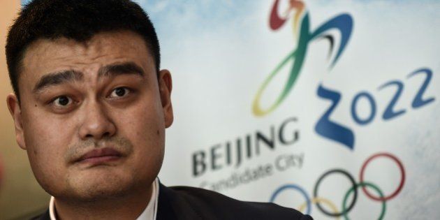 Retired Chinese professional basketball player Yao Ming looks on during a Beijing 2022 Olympics bid committee press briefing in Kuala Lumpur on July 29, 2015. Malaysia is hosting the 128th IOC session this week, with the 2022 Olympic Games bid between Beijing and Almaty in Kazakhstan to be decided by secret ballot in Kuala Lumpur. AFP PHOTO / MANAN VATSYAYANA (Photo credit should read MANAN VATSYAYANA/AFP/Getty Images)