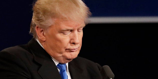 Republican presidential nominee Donald Trump listens to an answer to a question from Democratic presidential nominee Hillary Clinton during the presidential debate at Hofstra University in Hempstead, N.Y., Monday, Sept. 26, 2016. (AP Photo/David Goldman)